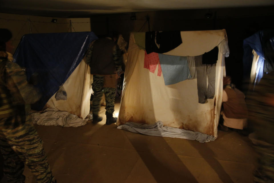 Participants wait in their tents at 'nighttime' in the camp at A Day in the Life of a Refugee.