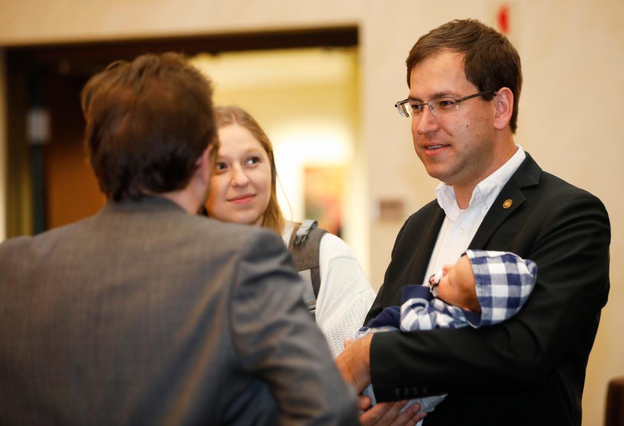 Republican candidate for Missouri House of Representatives Alex Riley talks with supporters at the Greene County GOP watch party on Tuesday, Nov. 8, 2022.