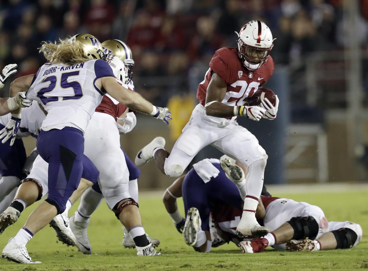 Stanford ‘s Bryce Love (20) runs against Washington during the first half of an NCAA college football game Friday, Nov. 10, 2017, in Stanford, Calif. (AP Photo/Marcio Jose Sanchez)