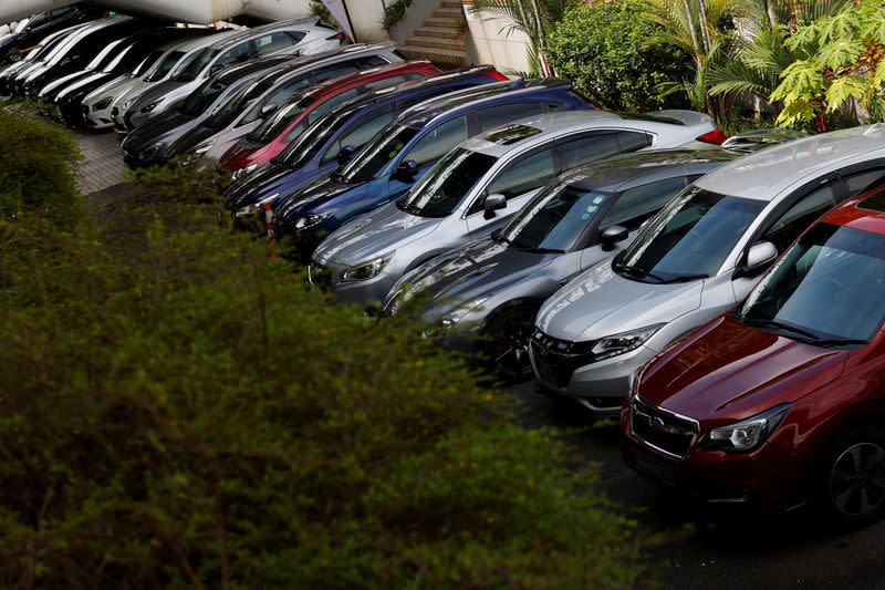 Cars for sale are parked at used car dealerships in Singapore