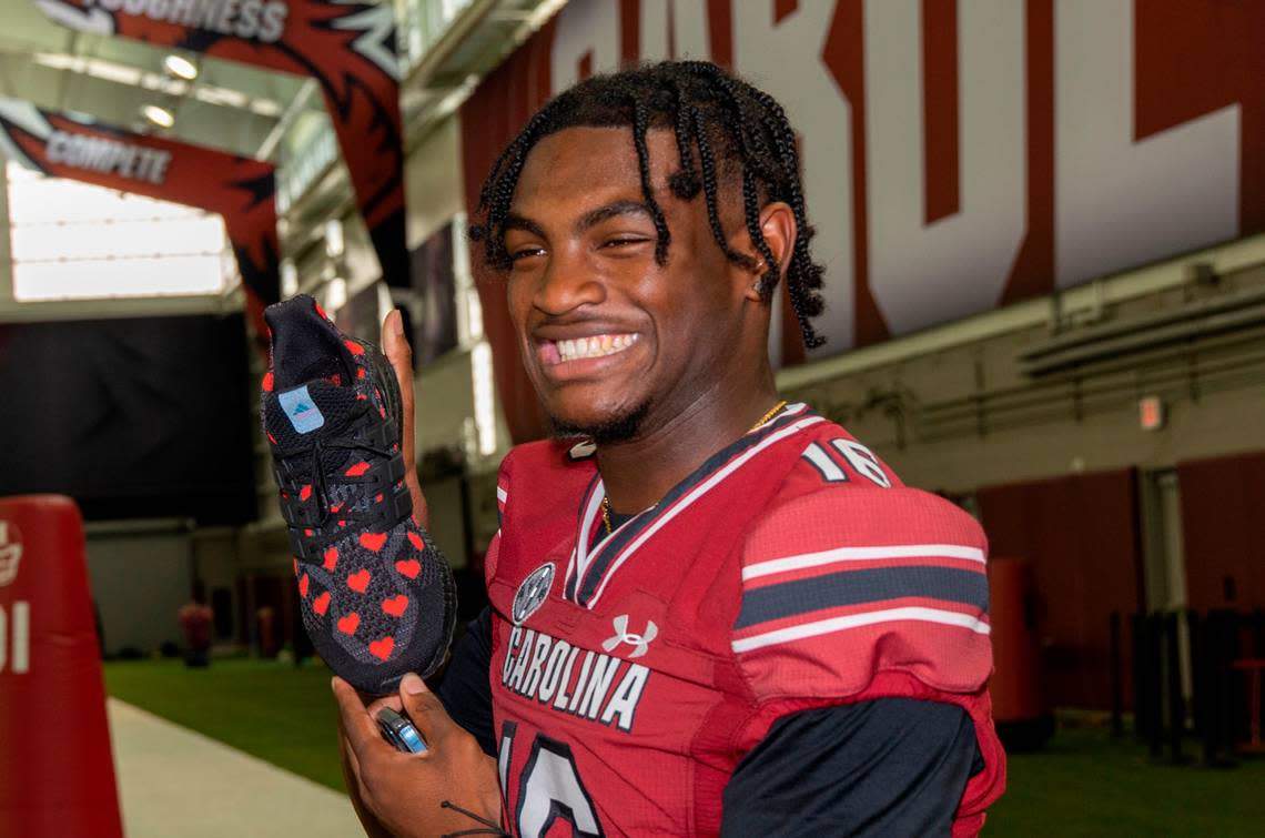 Corey Rucker shows off his shoes during team media day on Thursday, Aug. 4, 2022 in the Jerri and Steve Spurrier Indoor Practice Facility.