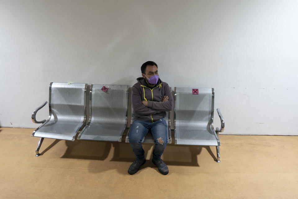 A patient waits in the COVID-19 testing area of the Ajusco Medio General Hospital which is designated for COVID-19 cases only, in Mexico City, Tuesday, Aug. 31, 2021. (AP Photo/Marco Ugarte)