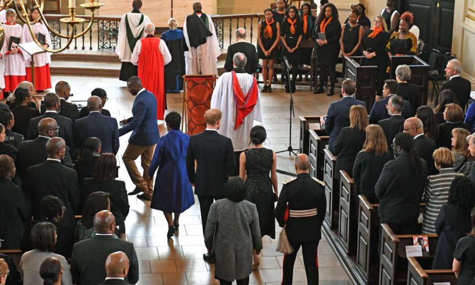 Prince Harry and Meghan Markle at the memorial service with Doreen Lawrence