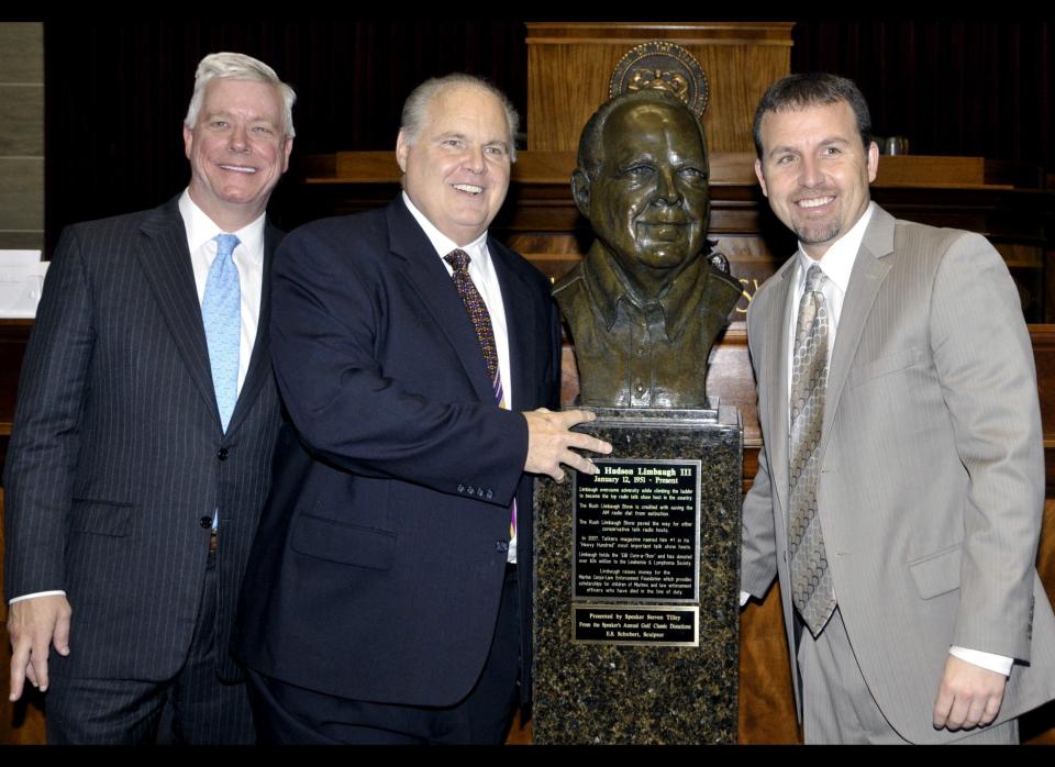 Lt. Gov Peter Kinder, left, and Speaker of the House, Steven Tilley, right, pose with conservative commentator Rush Limbaugh and a bust in Limbaugh's likeness during a secretive ceremony inducting Limbaugh into the Hall of Famous Missourians on Monday, May 14, 2012, in the state Capitol in Jefferson City, Mo. (AP Photo/Julie Smith)