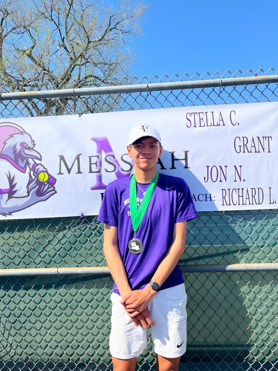 Jon Nugyen after winning his second consecutive ACEL state tennis championship.