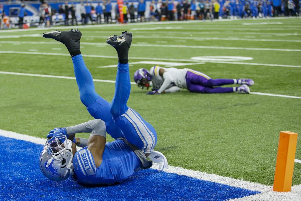 Detroit Lions' DJ Chark catches a touchdown pass in front of Minnesota Vikings' Cameron Dantzler Sr. during the first half of an NFL football game Sunday, Dec. 11, 2022, in Detroit. (AP Photo/Duane Burleson)
