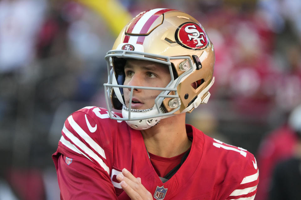 San Francisco 49ers quarterback Brock Purdy (13) warms up before an NFL football game against the Arizona Cardinals, Sunday, Dec. 17, 2023, in Glendale, Ariz. (AP Photo/Rick Scuteri)