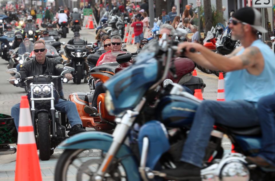 Motorcycle riders take over Main Street on Friday's opening day of Bike Week in Daytona Beach. The 10-day event runs through March 10 in Daytona Beach and throughout Central Florida. Despite cloudy skies, the mood on opening day was upbeat among visitors, vendors and merchants.