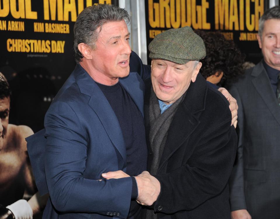 Actors Sylvester Stallone and Robert De Niro attend the world premiere of "Grudge Match", benefiting the Tribeca Film Institute, at the Ziegfeld Theatre on Monday, Dec. 16, 2013 in New York. (Photo by Evan Agostini/Invision/AP)