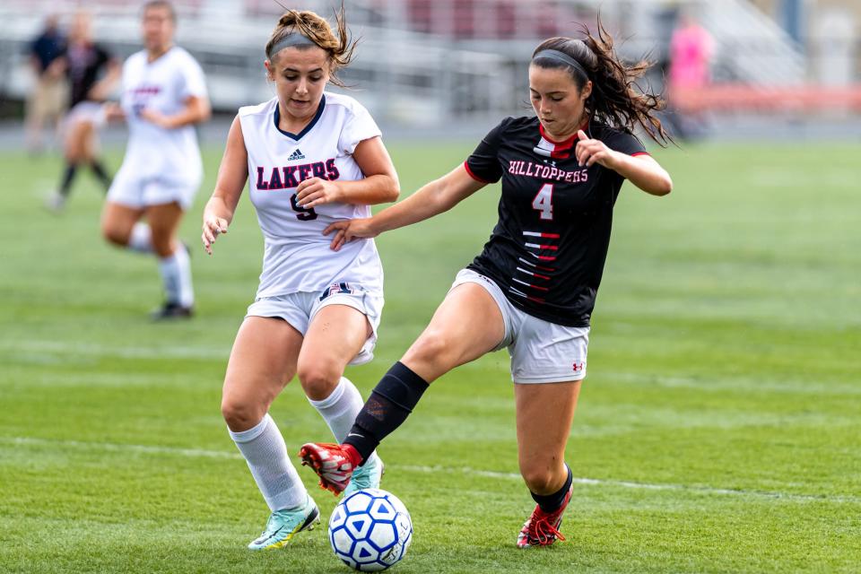 Durfee’s Julia Hargraves keeps the ball from an Apponequet defender during a game last season.