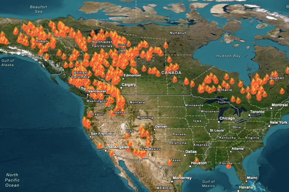 A map shows the number of wildfires burning across the US and Canada on Monday (NASA/USDA Forest Service)