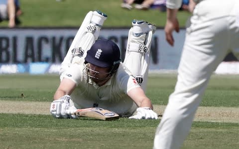 England's Dom Sibley dives to make his ground - Credit: AP Photo/Mark Baker