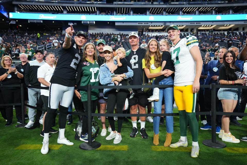 Kicker Anders Carlson of the Green Bay Packers and kicker Daniel Carlson of the Las Vegas Raiders pose with family prior to a game at Allegiant Stadium on Oct. 9, 2023, in Las Vegas.