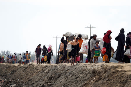 Newly arrived Rohingya refugees make their way to a camp in Cox's Bazar, Bangladesh, October 2, 2017. REUTERS/Cathal McNaughton