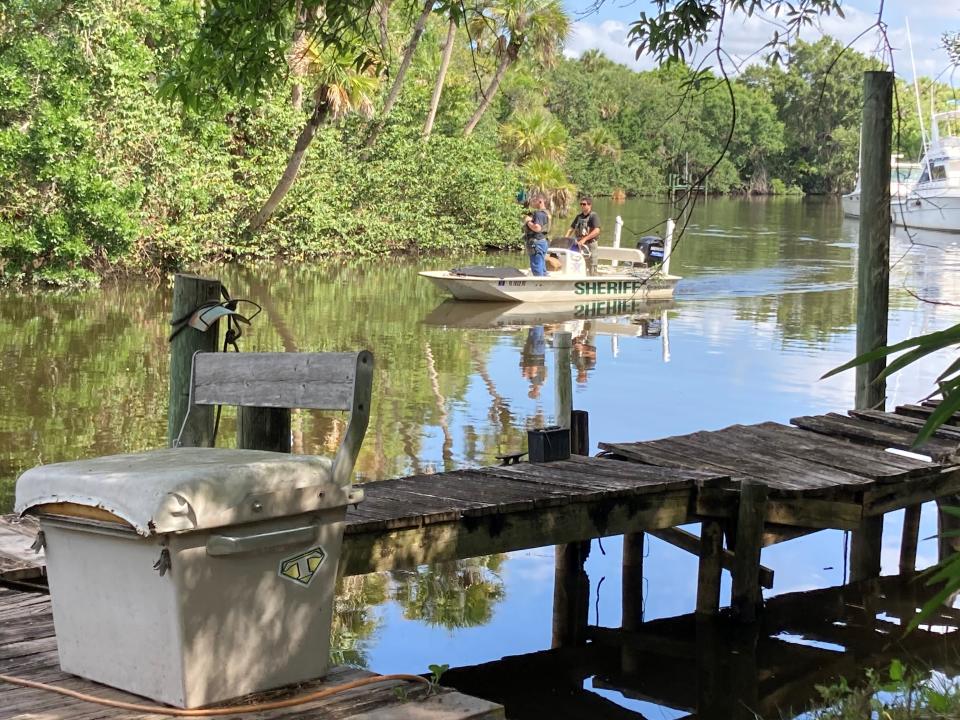 Martin County sheriff’s officials ride the St. Lucie River on Tuesday just west of Kanner Highway and just south of Cove Road. Several hours earlier a vehicle reportedly stolen out of Boynton Beach crashed in the waterway.