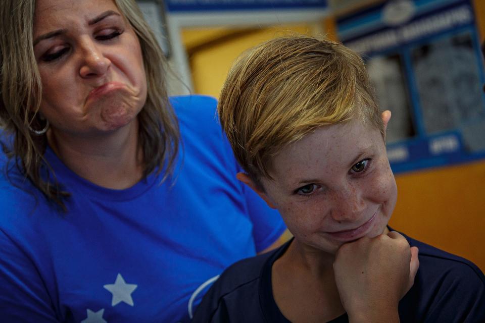 Gabe and his mom Brittany Richards watch hatchlings be cleaned of sand and maggots. The family traveled from Florence, Alabama to Palm Beach County to have Gabe's wish of seeing sea turtles fulfilled.