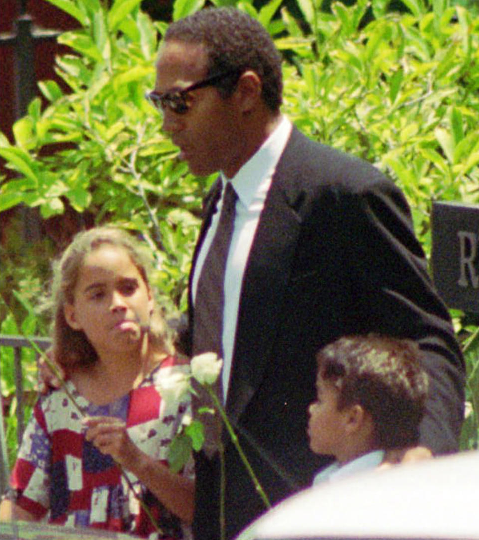 FILE - In this June 16, 1994, file photo, O.J. Simpson, center, daughter Sydney and son Justin arrive at a private funeral for his ex-wife Nicole Brown Simpson in the Brentwood section of Los Angeles. Simpson’s ex-wife, Nicole Brown Simpson, and her friend Ronald Goldman were found stabbed to death outside her LA home. Investigators quickly focused their attention on the former football great, leading to the slow-speed chase that was carried live on national television and, later, the “Trial of the Century,” which ended in Simpson’s acquittal. (AP Photo/Eric Draper, File)