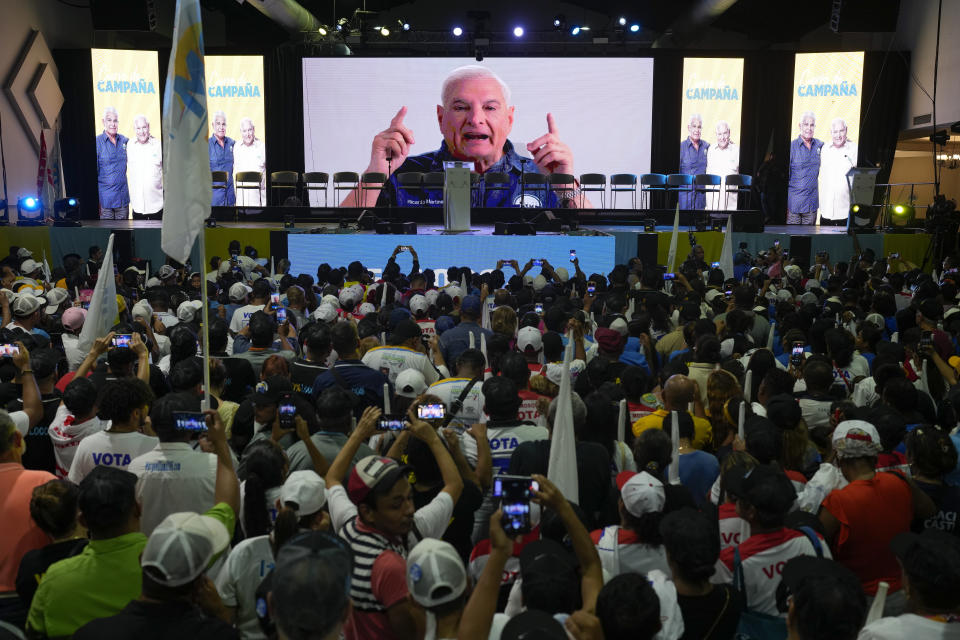 FILE - Former President Ricardo Martinelli sends a video message from inside the Nicaraguan embassy to supporters, during a campaign rally for presidential frontrunner Jose Raul Mulino, in Panama City, April 28, 2024. Martinelli has been campaigning for his former running mate from inside the walls of Nicaragua’s embassy, where he took refuge in February after receiving political asylum. (AP Photo/Matias Delacroix, File)