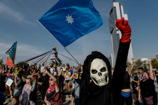 A demonstrator gestures during a protest against the government of Chilean President Sebastian Pinera in Santiago on January 24, 2020