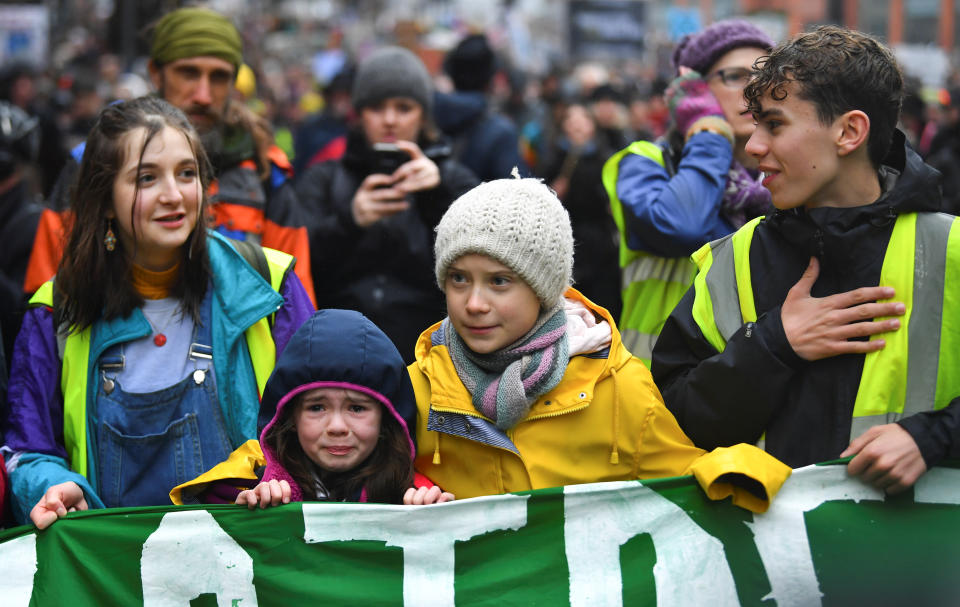 Swedish environmental activist Greta Thunberg embraces a crying girl who joined a march during a youth climate protest in Bristol, Britain, Britain February 28, 2020. REUTERS/Dylan Martinez