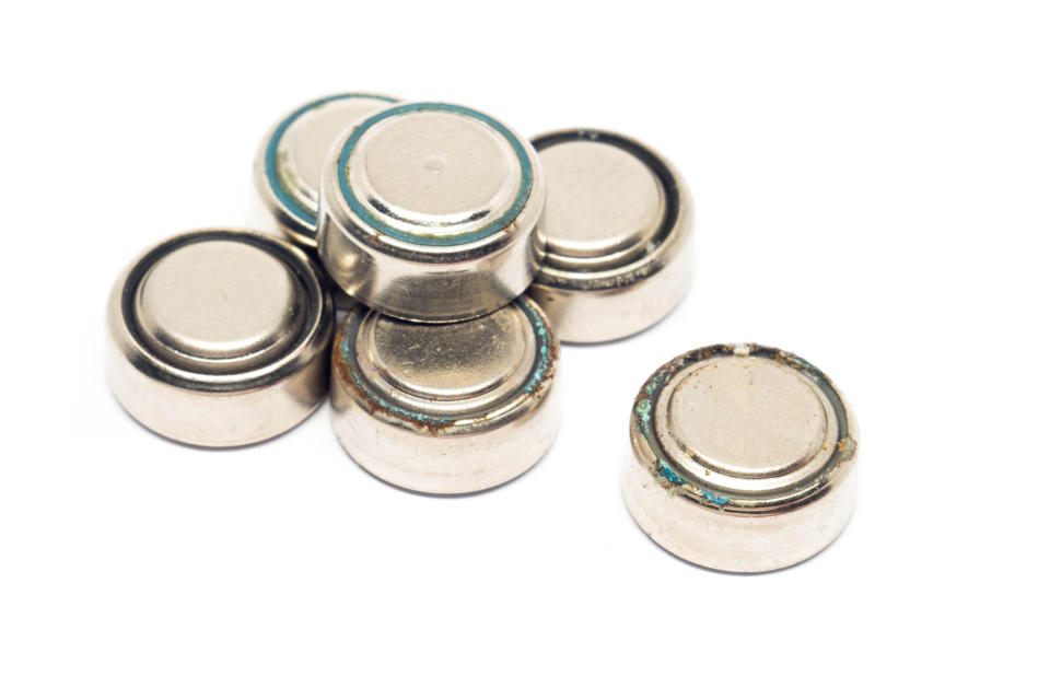 A number of button batteries are pictured.