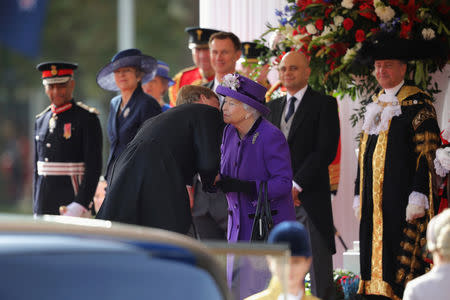 Britain's Queen Elizabeth greets King Willem-Alexander of the Netherlands during a ceremonial welcome at the start of a state visit at Horse Guards Parade, in London, Britain October 23, 2018. Christopher Furlong/Pool via REUTERS