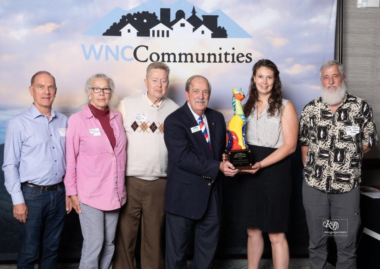 Laurel Community Center Organization (LCCO) Administrator Cheoah Landis, second from right, accepts the Calico Cat Sr. Award at the WNC Honors Awards in Asheville.