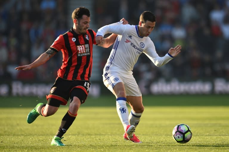 Bournemouth's Adam Smith (L) vies with Chelsea's Eden Hazard (R) during their match at the Vitality Stadium in Bournemouth, southern England on April 8, 2017