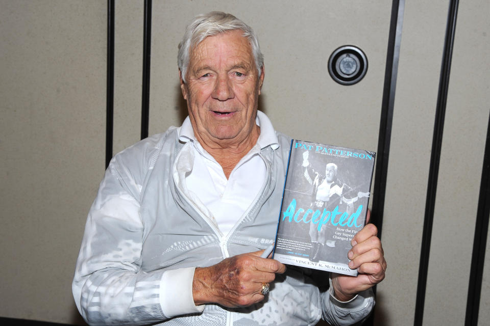 WWE legend Pat Patterson holds his book.