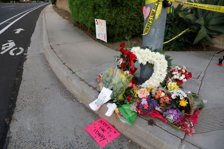 A makeshift memorial was placed by a light pole a block away from a shooting incident where one person was killed at the Congregation Chabad synagogue in Poway, north of San Diego, California, U.S. April 27, 2019. REUTERS/John Gastaldo