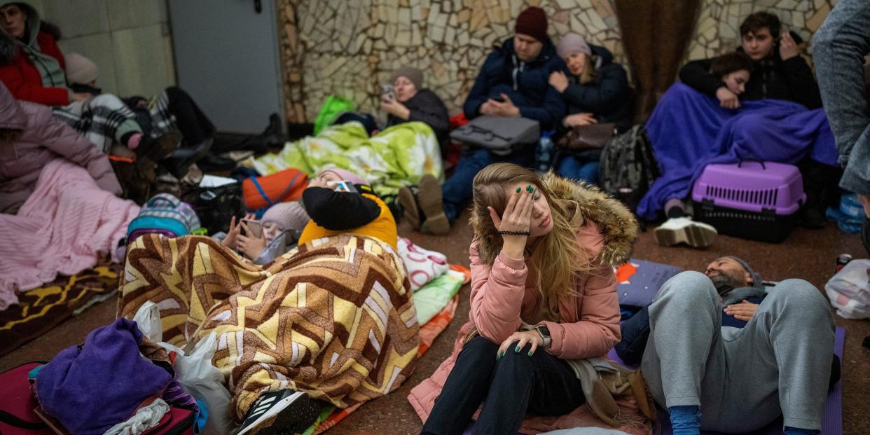 People rest in the Kyiv subway, using it as a bomb shelter in Kyiv, Ukraine, Thursday, Feb. 24, 2022.