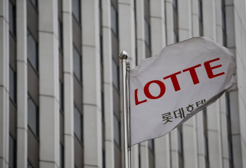 A flag bearing the logo of Lotte Hotel flutters at a Lotte Hotel in Seoul