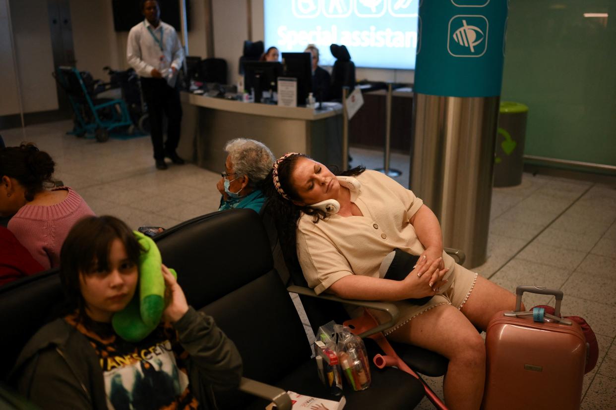 Passengers wait at Gatwick Airport, south of London, on August 29, 2023 after UK flights were delayed over a technical issue. Flights to and from the UK were experiencing disruptions after Britain's air traffic control systems were temporarily hit by a technical fault. The National Air Traffic Services (NATS) said it had 