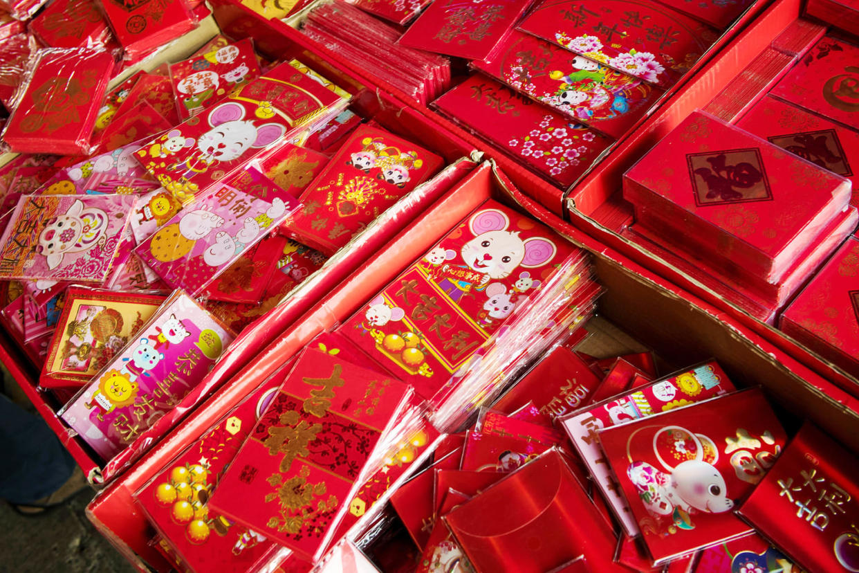 Exchanging red envelopes is a common tradition during Chinese New Year. (David Paul Morris / Bloomberg via Getty Images)