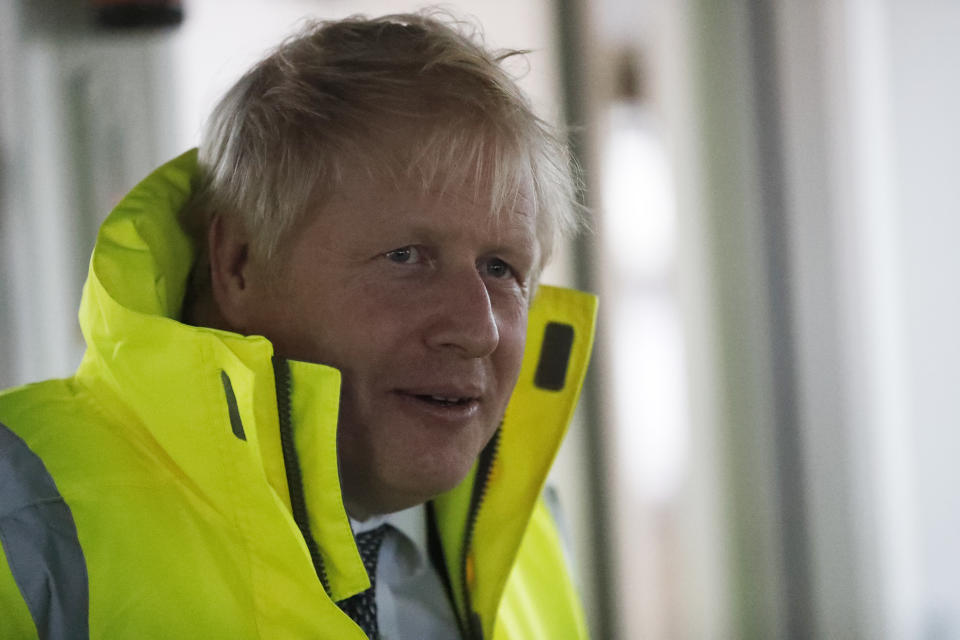 Britain's Prime Minister Boris Johnson looks out from the steering cabin of tug boat during a General Election campaign trail stop in the port of Bristol, England, Thursday, Nov. 14, 2019. Britain goes to the polls on Dec. 12. (AP Photo/Frank Augstein, Pool)