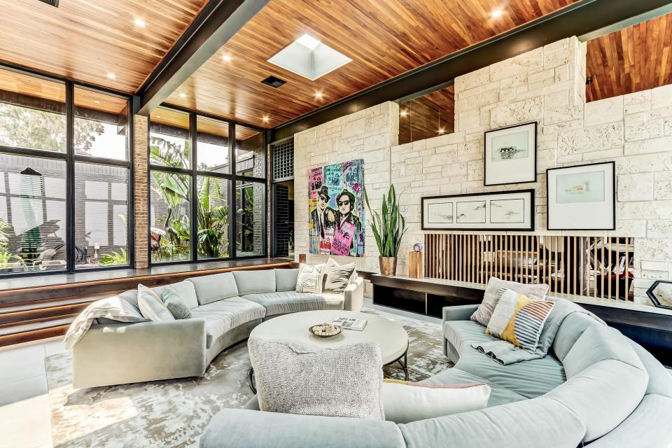 The main living area at 3215 Front Road, the former home of ex-Jaguars kicker Josh Lambo, is highlighted by a commissioned painting of Jake and Elwood Blues, also known as the Blues Brothers.