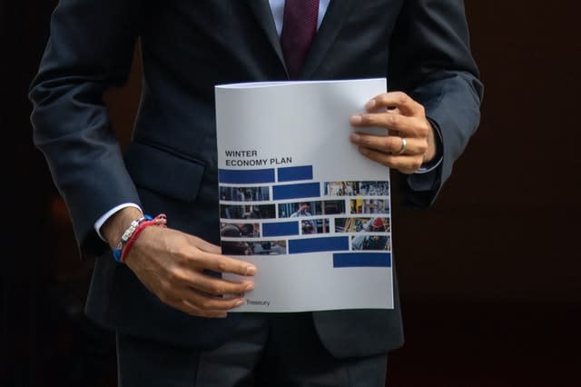 Chancellor Rishi Sunak holds a copy of his Winter Economy Plan 