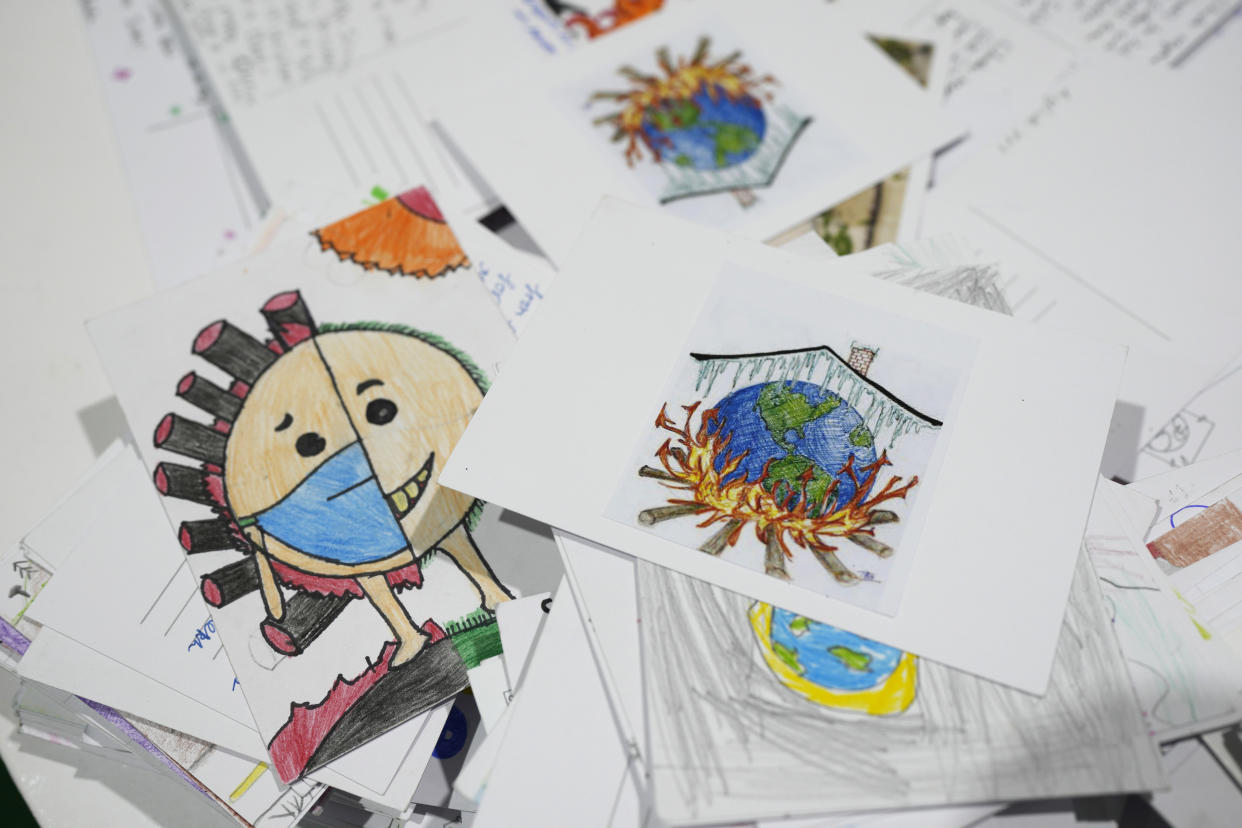 Letters and drawings left behind are gathered at the Youth Pavilion at the COP27 U.N. Climate Summit, Saturday, Nov. 19, 2022, in Sharm el-Sheikh, Egypt. (AP Photo/Peter Dejong)