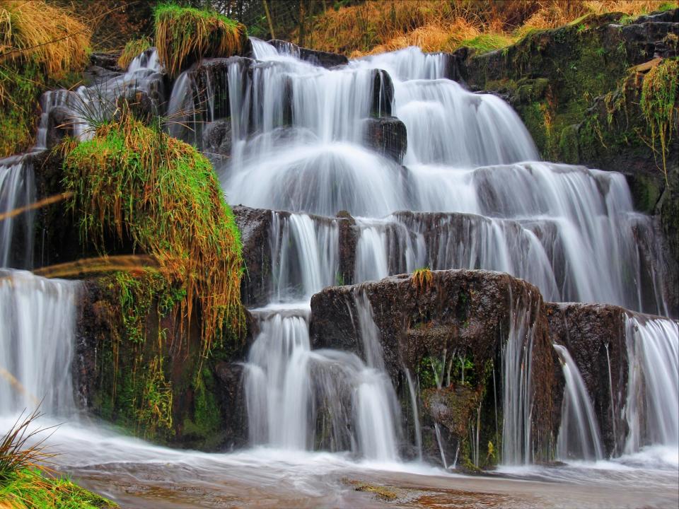 Glyncorrwg waterfall sits just south of the Brecon Beacons mountain range.