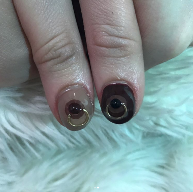 The boobs come complete with nipple rings [Photo: Instagram/nailsbymei]