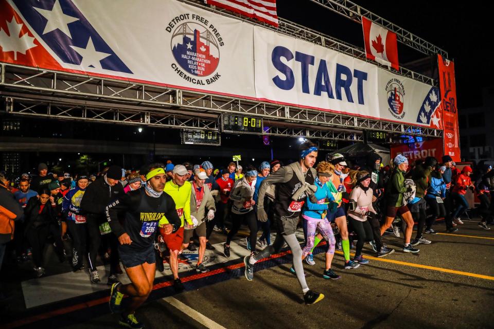 Runners take off in waves for the half and full marathon down Fort street, during the 41st Annual Detroit Free Press/Chemical Bank Marathon in Detroit on Sunday, Oct. 21, 2018.