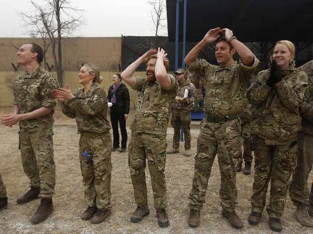 British fans react during a football match between British and German troops to commemorate the Christmas Truce of 1914, at the ISAF Headquarters in Kabul December 24, 2014. REUTERS/Omar Sobhani