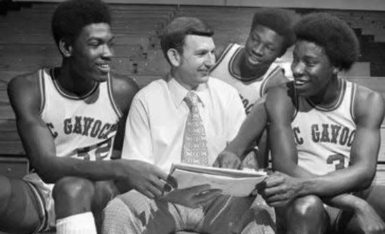 McGavock seniore Charles Davis, left, David Woods, adn Fred Harris, along with Joe Allen led the Raiders to the 1976 Class AAA boys basketball state championship.