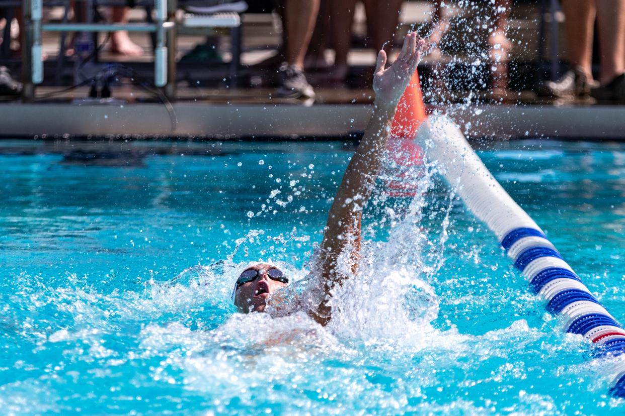 Sebastian River's Louis St. Petery swims to victory in the 100 backstroke during the Region 4-3A swimming and diving championships at Sailfish Splash Waterpark on Wednesday, Nov. 1, 2023 in Stuart.