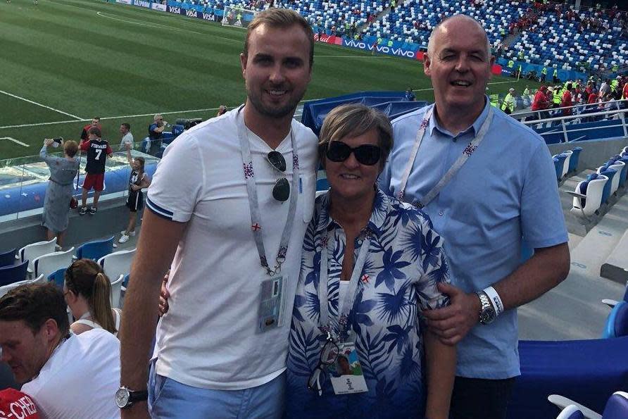 Proud family: Charlie Kane with parents Kim and Patrick cheer on hat-trick Harry (Charlie Kane/Twitter)