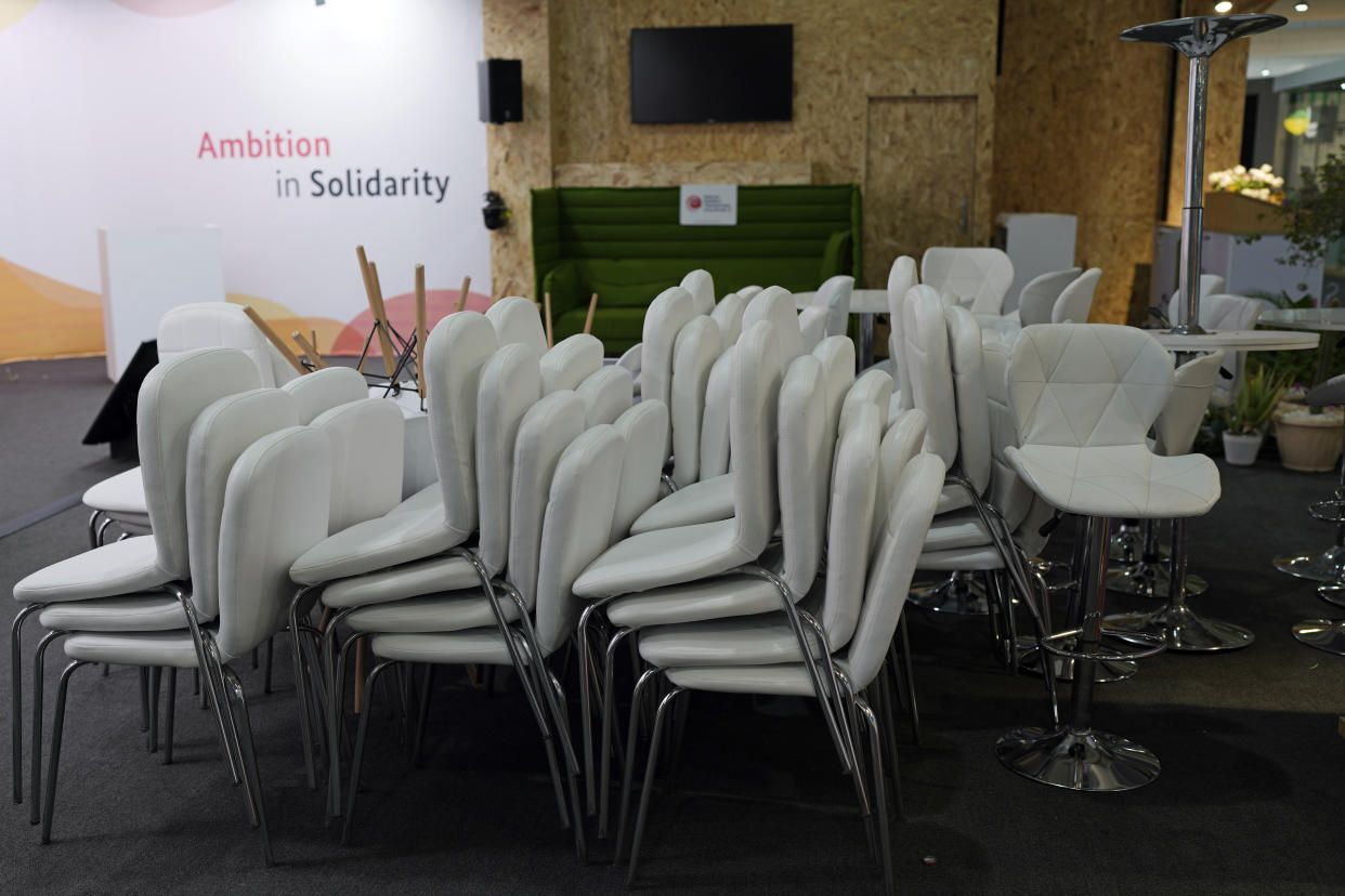 Chairs are stacked up as the COP27 U.N. Climate Summit continues, Saturday, Nov. 19, 2022, in Sharm el-Sheikh, Egypt. (AP Photo/Peter Dejong)