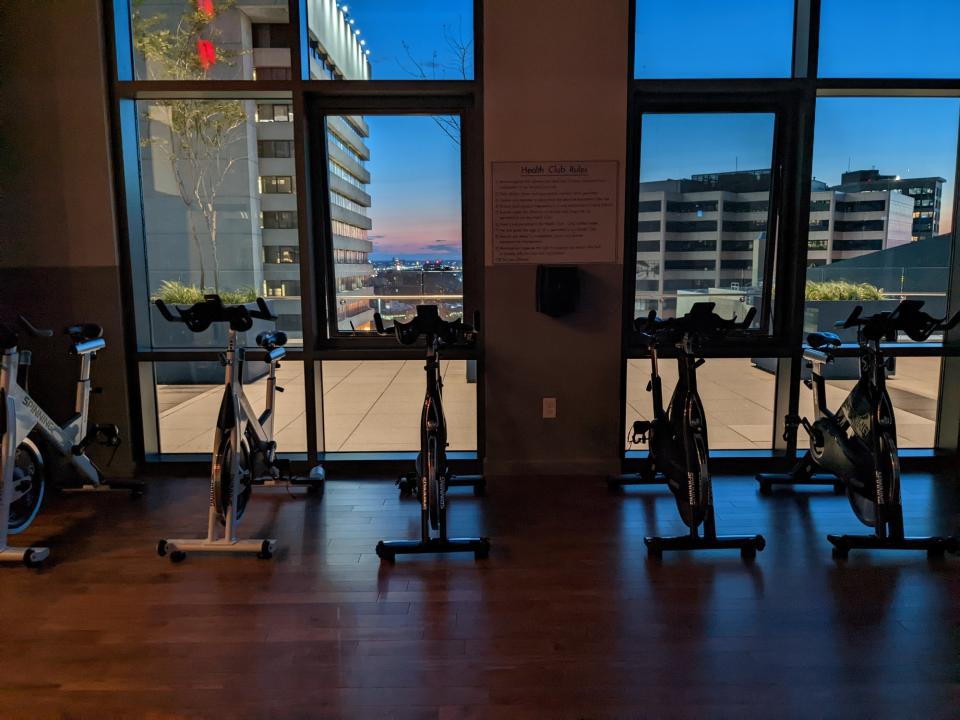 <p>A picture from the Pixel 6a's camera, featuring five stationary bikes in a dark exercise room.</p>
