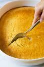 <p>It's no surprise that corn pudding is such a well-loved Southern side dish. In fact, for many people, it's just as expected on the table as dressing and gravy. </p><p><strong><a href="https://www.thepioneerwoman.com/food-cooking/recipes/a90213/corn-pudding/" rel="nofollow noopener" target="_blank" data-ylk="slk:Get the recipe.;elm:context_link;itc:0;sec:content-canvas" class="link ">Get the recipe.</a></strong> </p>