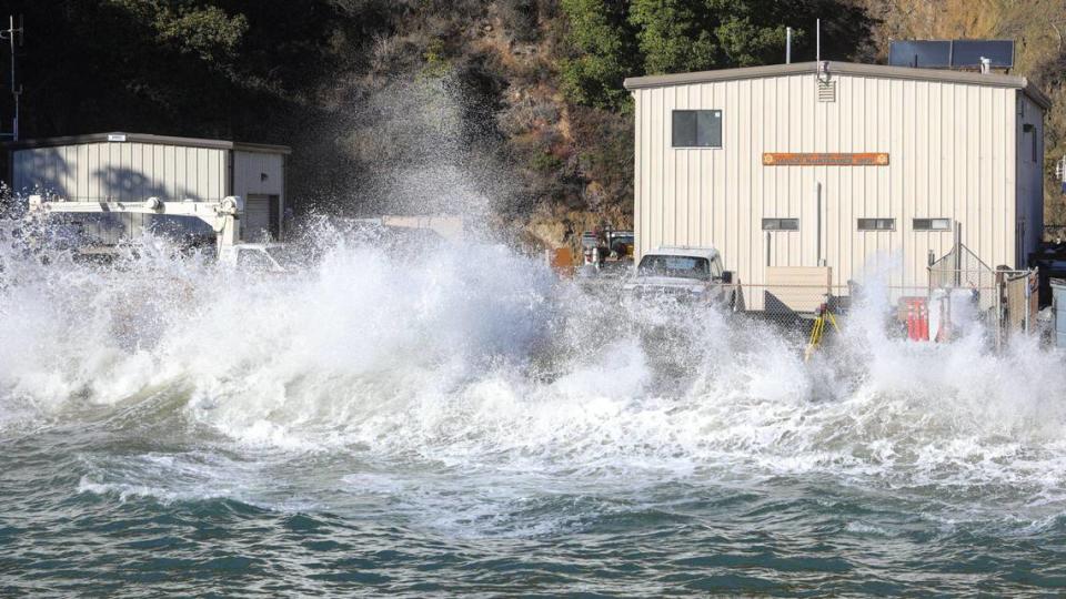 Waves crash Monday at the seawall next to the parking lot at Harford Pier as a king tides brought a 6.99-foot high tide to Port San Luis.