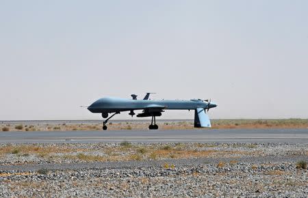 FILE PHOTO: A U.S. Predator unmanned drone armed with a missile stands on the tarmac of Kandahar military airport June 13, 2010. REUTERS/Massoud Hossaini/File Photo